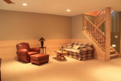 Multiple seating areas in the basement allow large groups to gather.